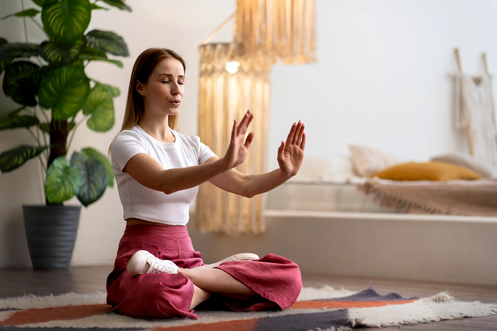 Woman meditating on beach