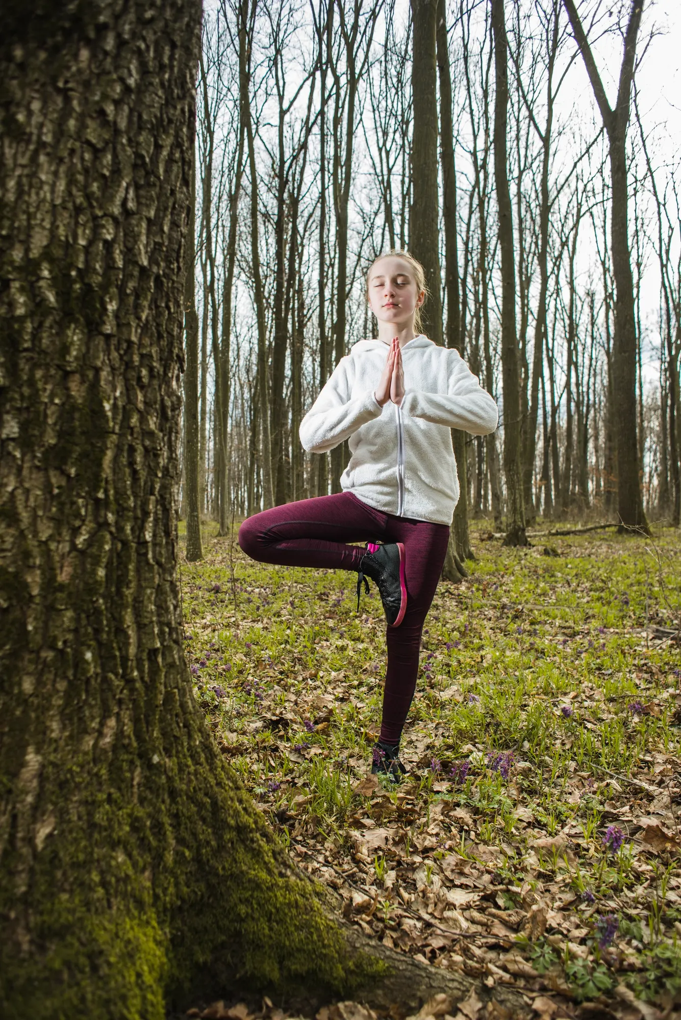 Woman meditating on beach