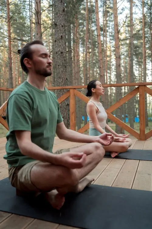 Woman meditating on beach