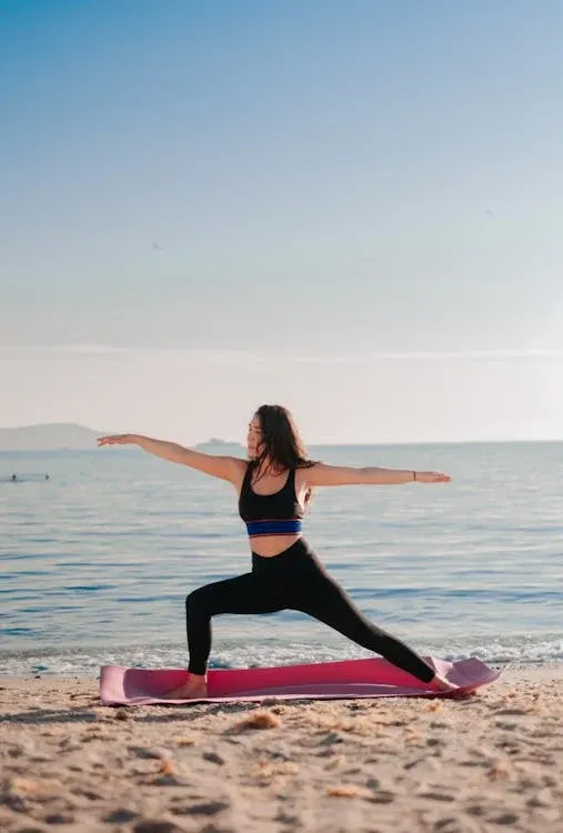 Woman meditating on beach